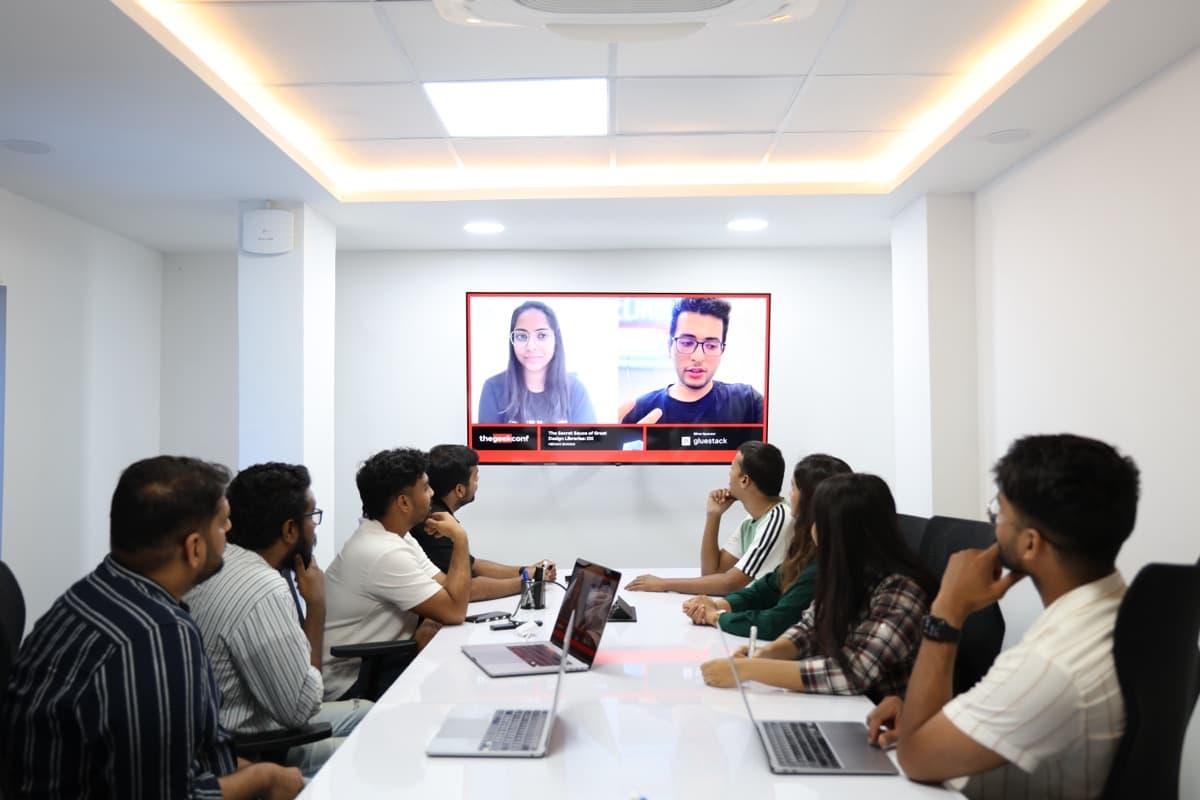 A GeekyAnts team on a call in a meeting room
